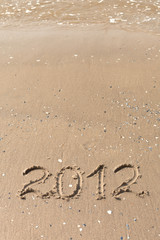 2012 Year written on the beach sand
