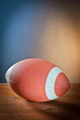 Sports equipment.rugby ball on wood.