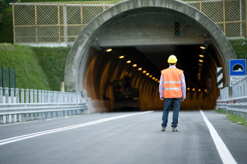 man in front of tunnel