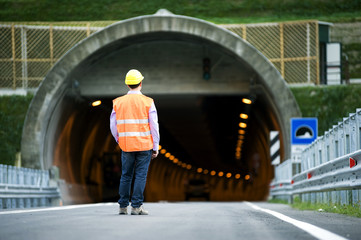 man in front of tunnel