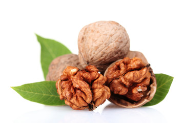 walnuts and leaves isolated on white