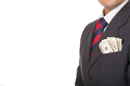 businessman wearing suit with money in the pocket