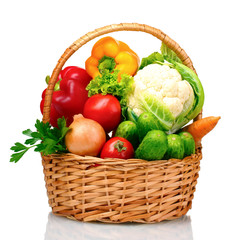 Fresh vegetables in basket isolated on white