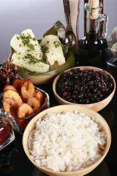 Staple latino sides, manioc, rice, plantains, and black beans