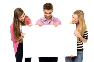 Three young people holding copyspace