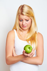 young blond woman is thinking negative about diet