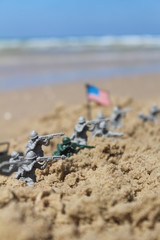 US toy soldiers on a fight near the sea with the american flag
