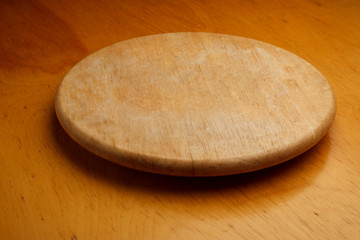 Front of wood kitchen turntable on wooden surface