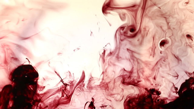Red Ink flowing in water