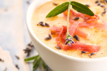 fresh melon soup with parma ham and lavender flower