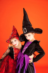 Halloween sister kid girls on orange