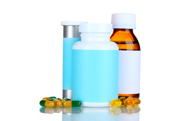Medical bottles and pills isolated on white