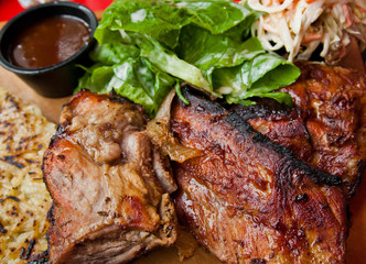 Grilled steak - Grilled meat ribs on the plate with hot sauce