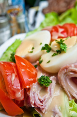 Fresh fruits salad and ham with egg