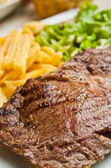 juicy steak beef meat with tomato and french fries