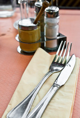 place setting - plate, knife and fork on table