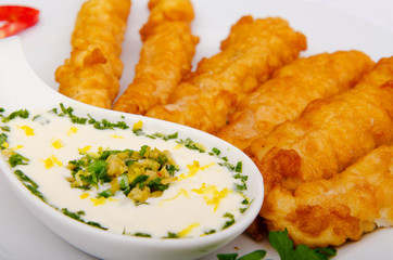 Battered chicken served with sauce
