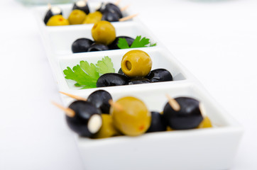 Naklejka na ściany i meble Olives served in the plate