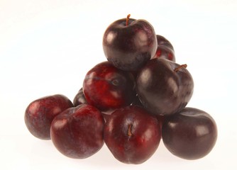 Plums on white background.
