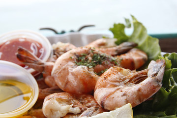 Grilled shrimps in harbour restaurant