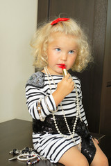 Obraz na płótnie Canvas baby girl with adult accessories