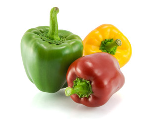 Red, green and yellow sweet pepper on a white background