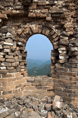 Looking out of stone brick window of Great Wall of China