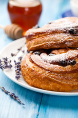 Sweet rolls with blueberries and icing sugar