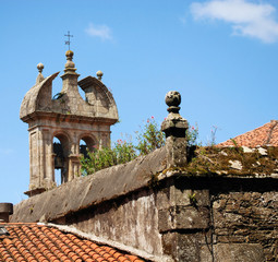 roof of  ancient house and church belltower in santiago-de-compo - 35876443
