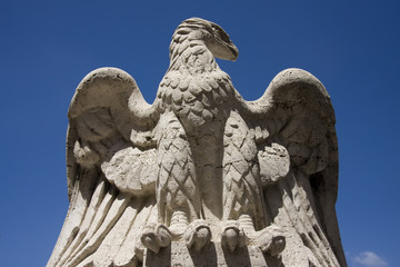 Eagle stone statue on the Saint Angelo Bridge in Rome, Italy