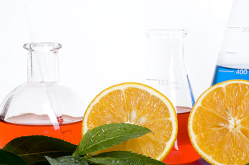 Laboratory flask and orange