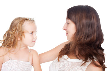 mother and daughter looking each other in eyes isolated on white