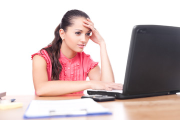 beautiful young woman sitting at office desk