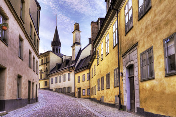 Cobblestone street with old beautiful buildings.