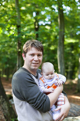 Young man with an adorable newborn baby boy