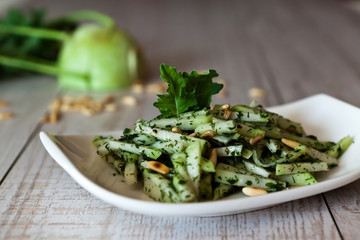 Kohlrabi salad on a wooden table