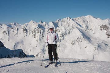 Fototapeta na wymiar Alpine skier mountains in the background
