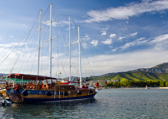 Old fashioned yacht sunny evening on quae