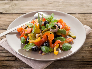dish with peperonata  basil and black olives