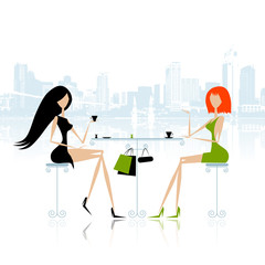 Fashion girls in cafe on the street