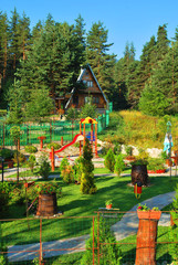 Beautiful summer house with flower garden and playground