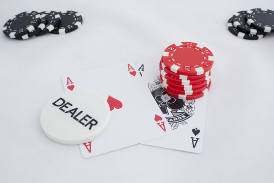 Pocker cards, dealer button and chips