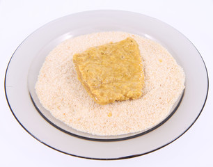 Soy Meat being prepared in breadcrumbs