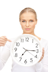 woman holding big clock