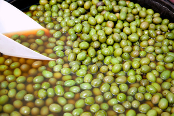 brine olive fruits in market round pot