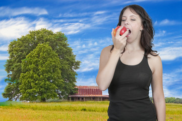 Fototapeta premium Woman Eating an Apple