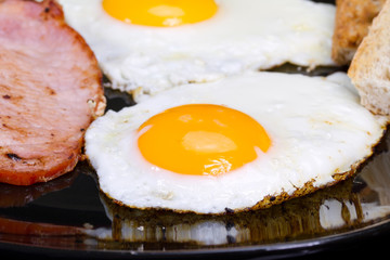 Irish breakfast with two eggs, bacon and toast