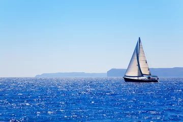 Fotobehang Blue Mediterranean sailboat sailing © lunamarina