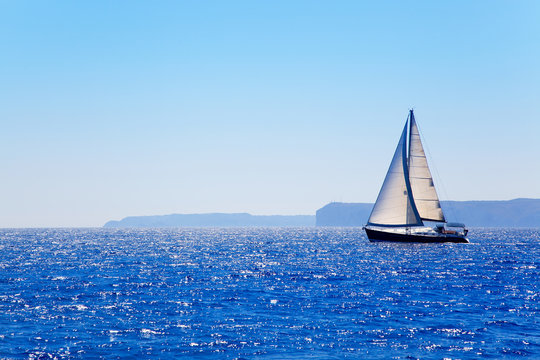 Fototapeta Blue Mediterranean sailboat sailing