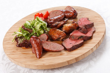 sausages on a wooden cutting board